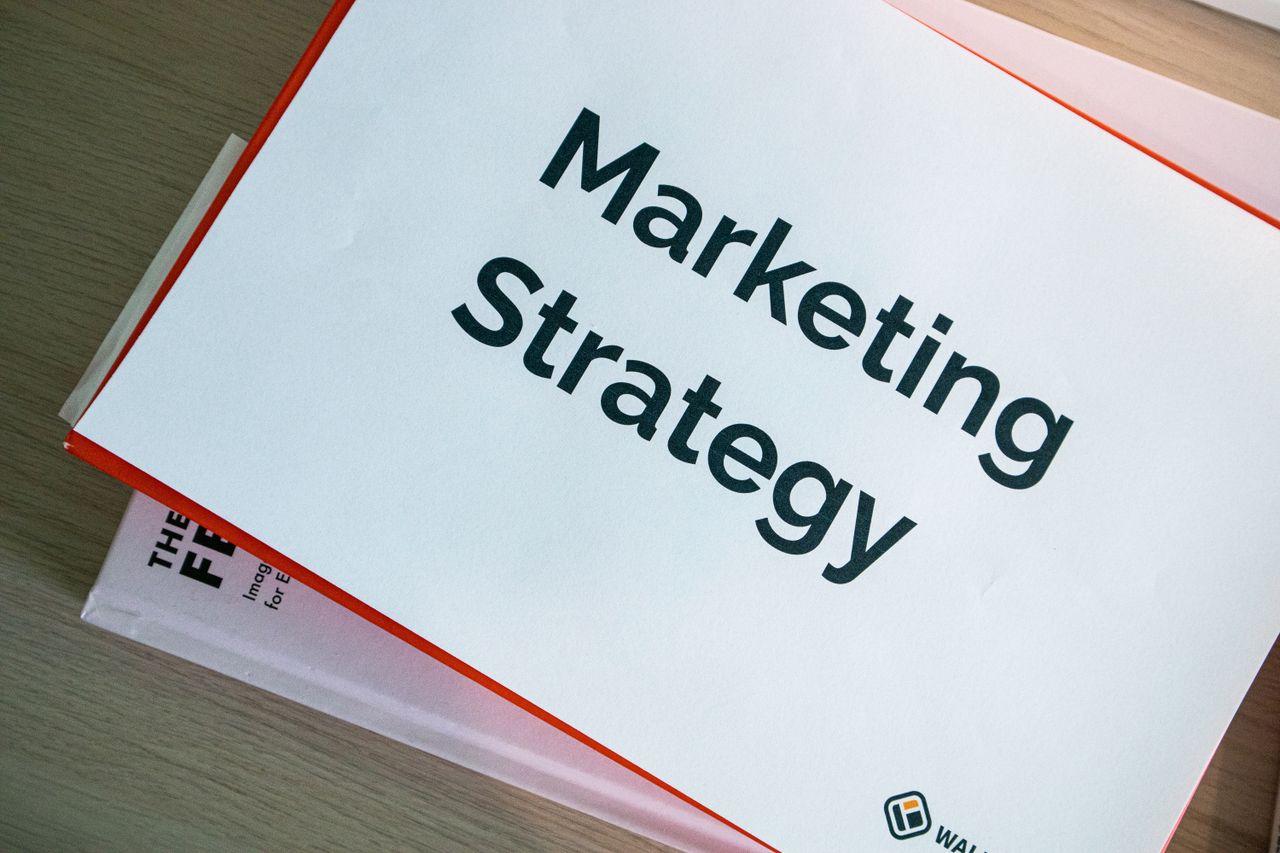 A marketing strategy document laid out on a desk, illustrating the essentials of business planning.